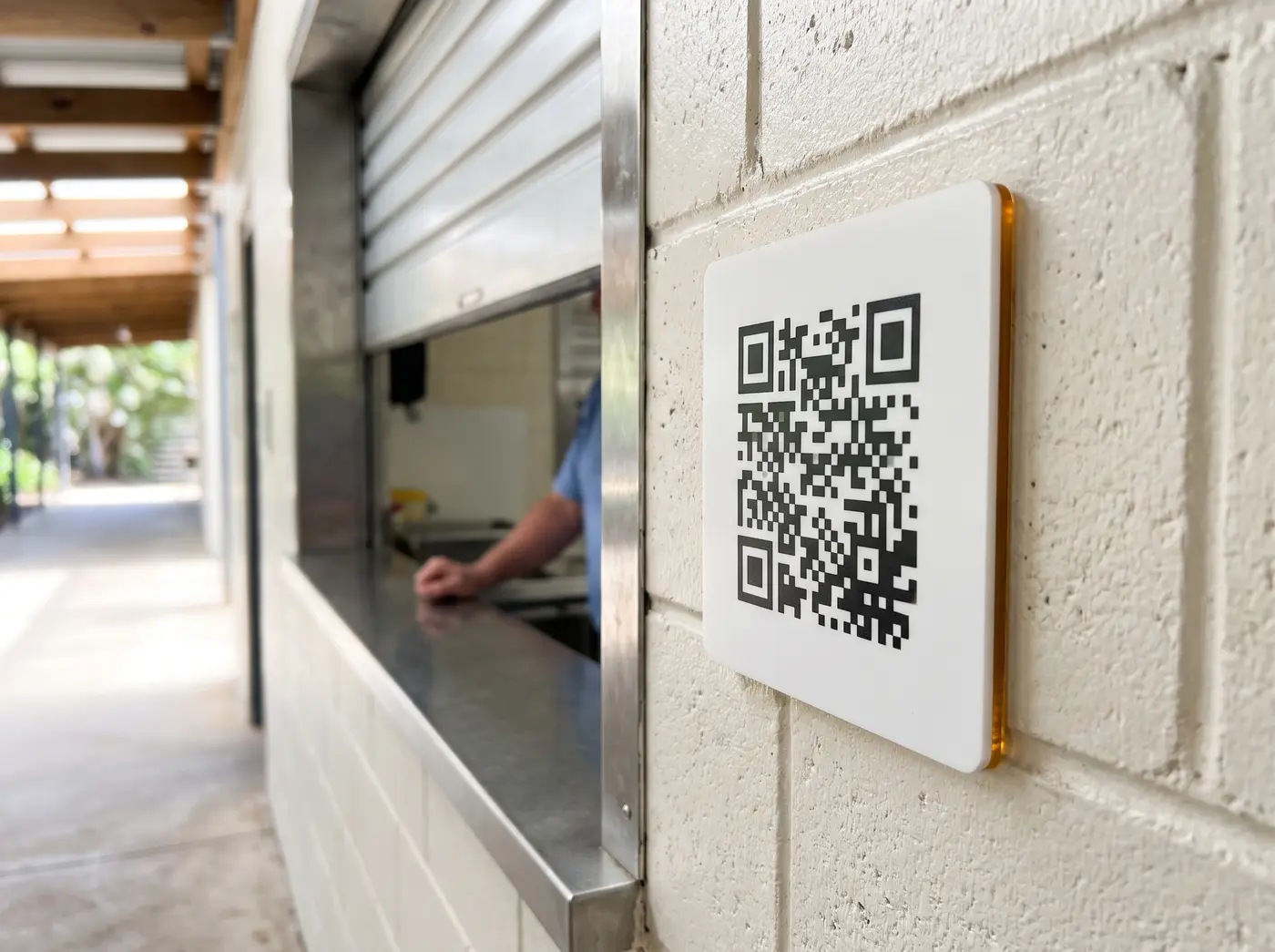 QR sighting sign beside a school tuckshop servery