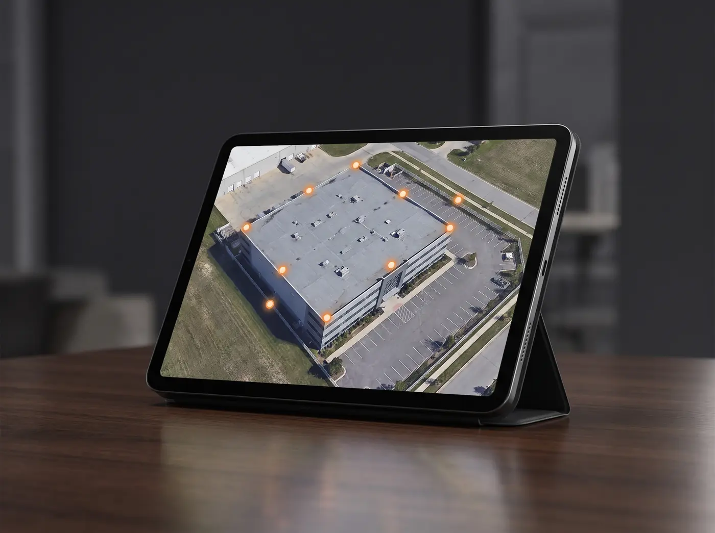 Tablet showing the site's Google aerial view with numbered bait stations